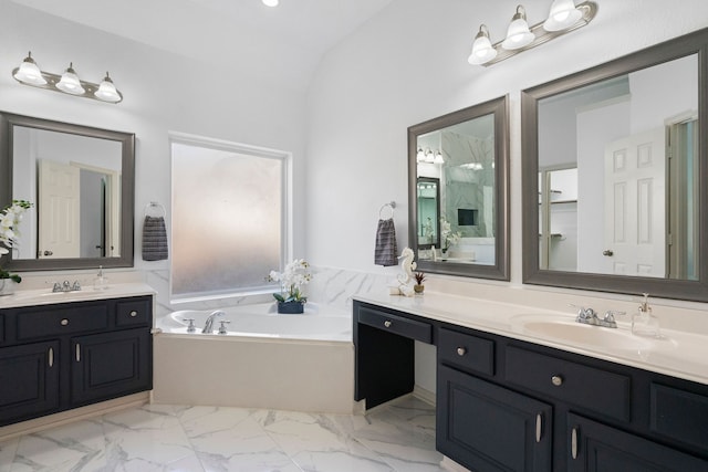 bathroom featuring a bathtub, lofted ceiling, and vanity