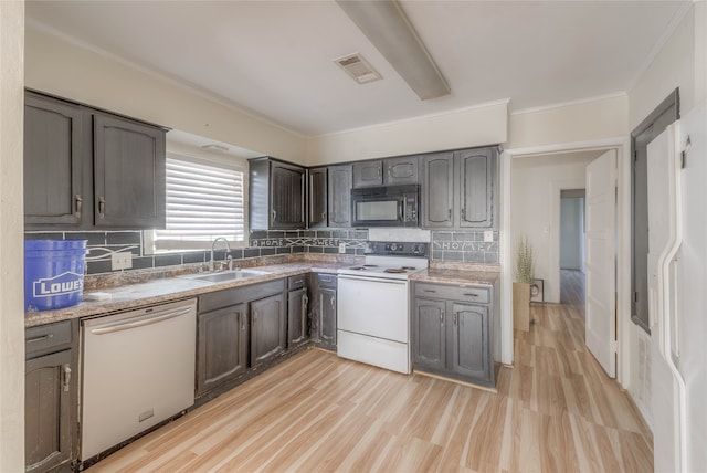 kitchen featuring dishwasher, backsplash, white electric range, sink, and light hardwood / wood-style floors