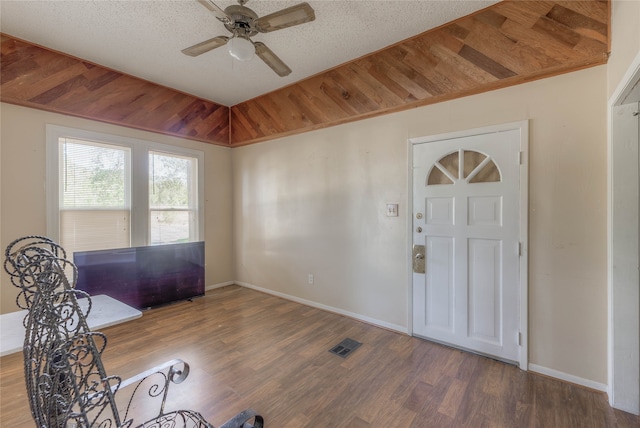 foyer with ceiling fan, hardwood / wood-style floors, and a textured ceiling