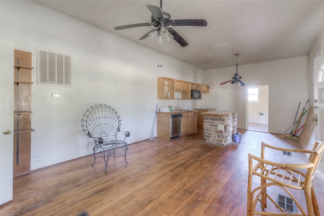 sitting room featuring ceiling fan and dark hardwood / wood-style floors