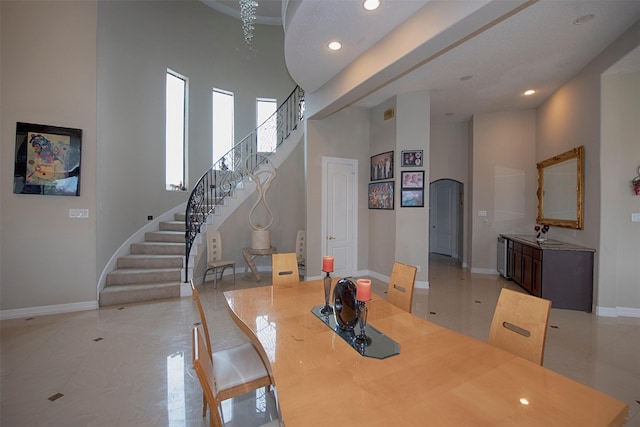 dining area with a high ceiling