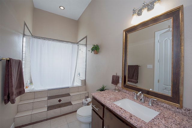 bathroom featuring toilet, tile patterned flooring, walk in shower, and vanity