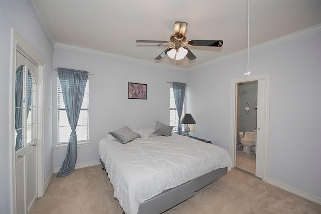 carpeted bedroom with ceiling fan, ensuite bathroom, and ornamental molding