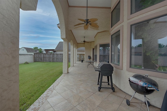 view of patio featuring ceiling fan and area for grilling