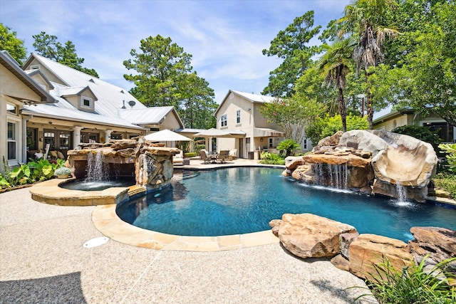 view of pool featuring a patio and pool water feature