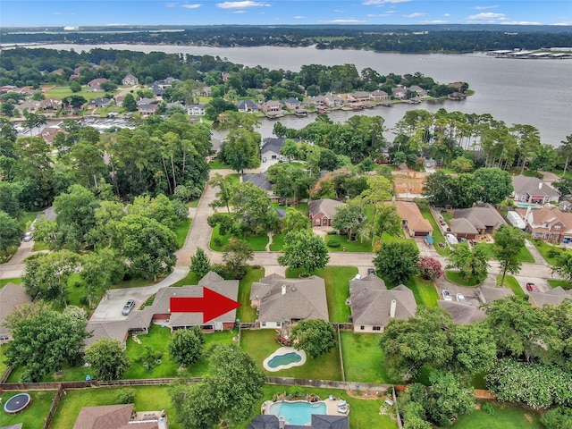 bird's eye view featuring a residential view and a water view