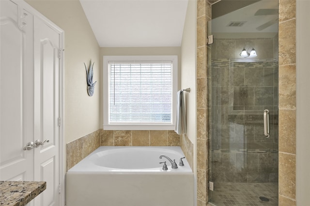 bathroom with separate shower and tub