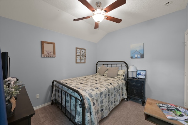 bedroom featuring a textured ceiling, vaulted ceiling, carpet floors, and ceiling fan