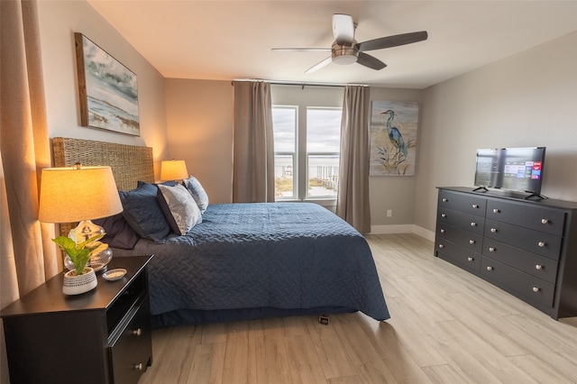 bedroom featuring ceiling fan and light wood-type flooring