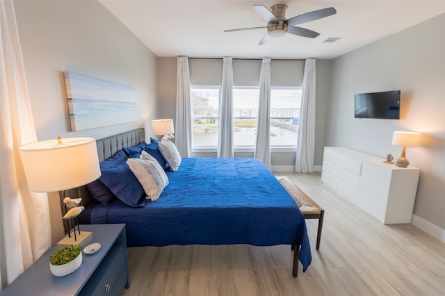 bedroom featuring light wood-type flooring and ceiling fan