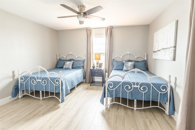 bedroom featuring ceiling fan and light hardwood / wood-style floors