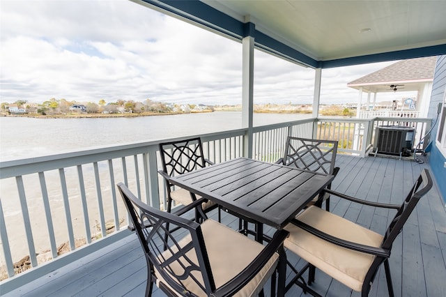 deck featuring central AC and a water view