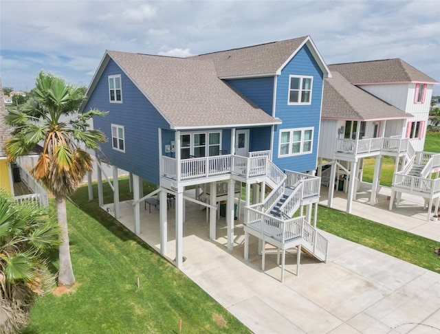 rear view of property featuring a yard