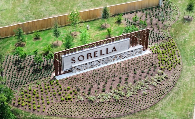 community sign featuring fence