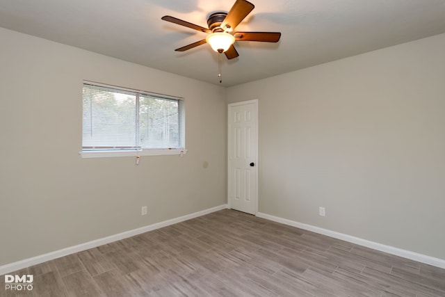 unfurnished room featuring light wood-type flooring and ceiling fan