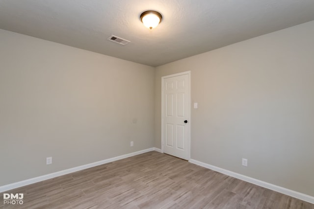 unfurnished room featuring light hardwood / wood-style flooring