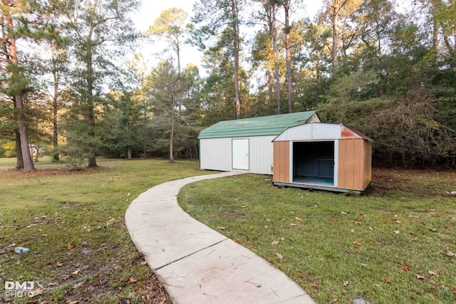 view of outbuilding with a yard