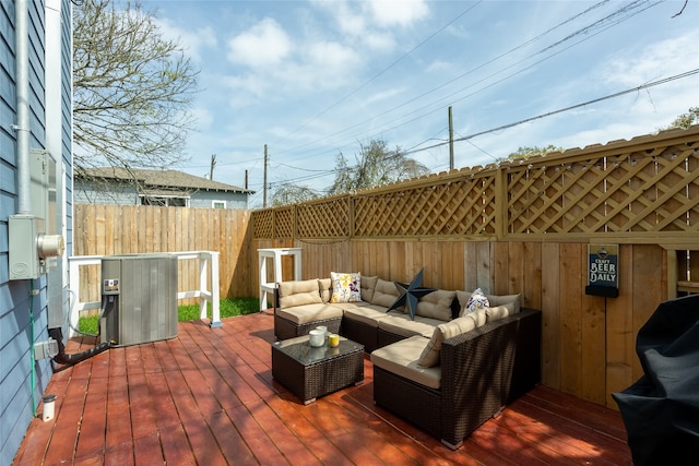 deck featuring an outdoor living space and central air condition unit
