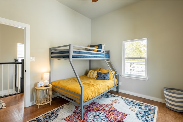 bedroom with hardwood / wood-style flooring