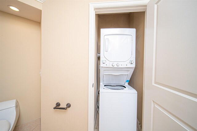 laundry area with stacked washer / dryer