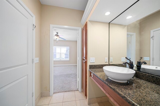 bathroom featuring tile floors, ceiling fan, and vanity