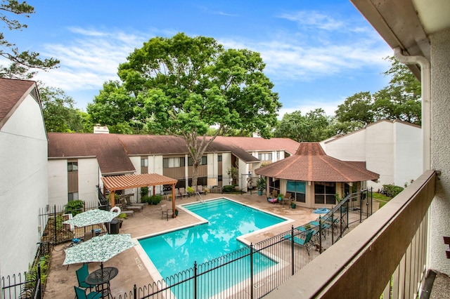 view of swimming pool with a gazebo and a patio