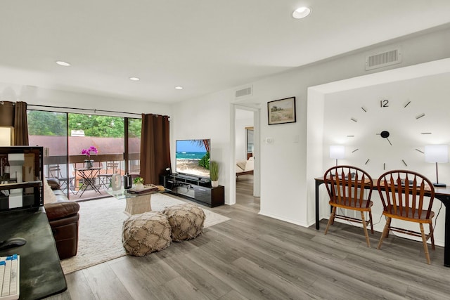 living room with light hardwood / wood-style flooring