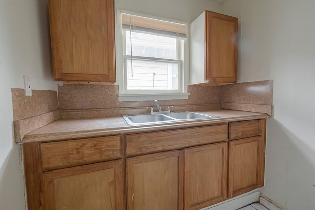 kitchen featuring backsplash and sink