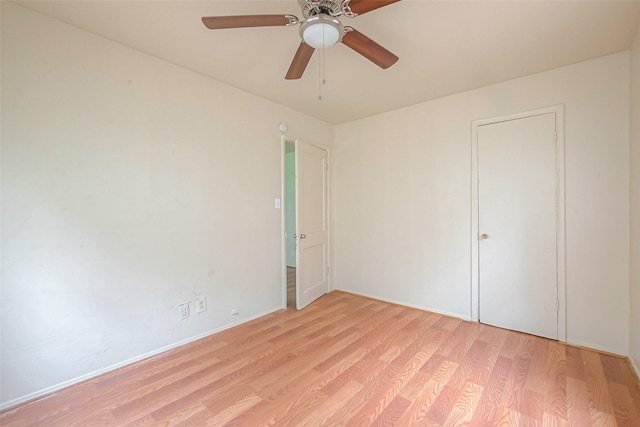 unfurnished bedroom featuring ceiling fan and light wood-type flooring