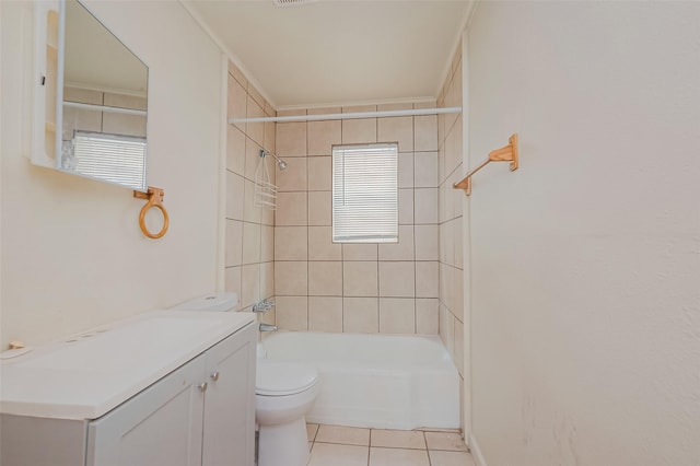 full bathroom with tile patterned floors, vanity, crown molding, toilet, and tiled shower / bath