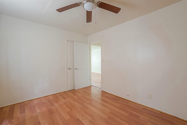 unfurnished room with ceiling fan and light wood-type flooring