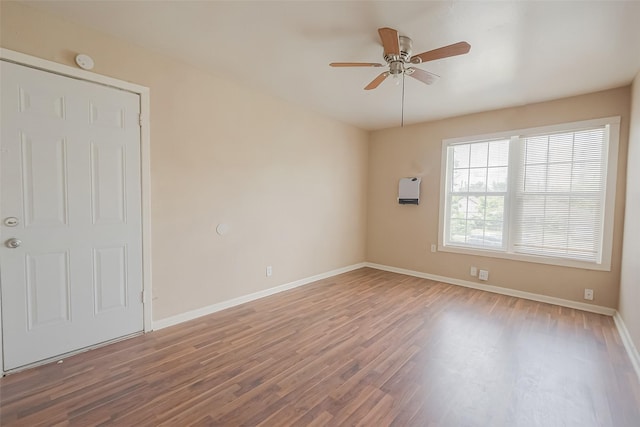 unfurnished room featuring hardwood / wood-style flooring and ceiling fan