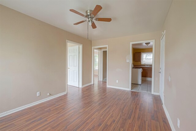 unfurnished room with ceiling fan and wood-type flooring