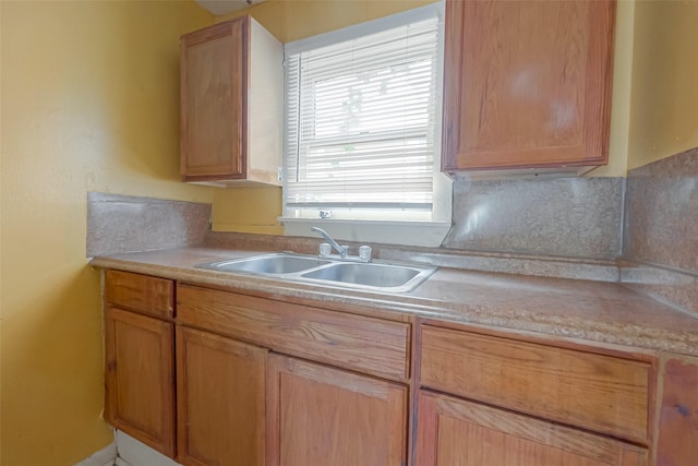 kitchen featuring light brown cabinets and sink