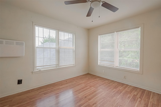 unfurnished room featuring ceiling fan and light hardwood / wood-style floors