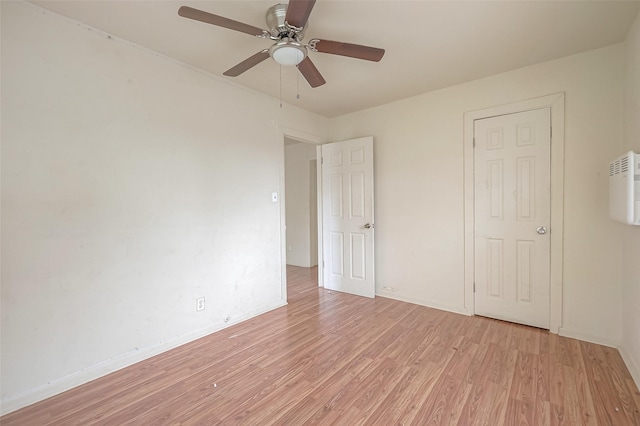 unfurnished bedroom featuring light hardwood / wood-style flooring and ceiling fan