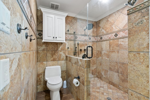 bathroom featuring walk in shower, tile walls, and ornamental molding