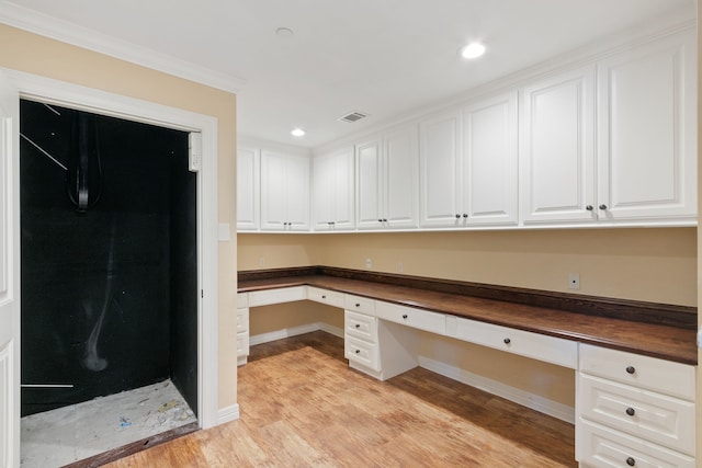 17018 Grant Rd, Cypress, TX 77429 - unfurnished office with built in study area, light wood finished floors, baseboards, crown molding, and recessed lighting