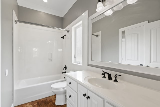 full bathroom featuring  shower combination, toilet, vanity, wood-type flooring, and a wealth of natural light