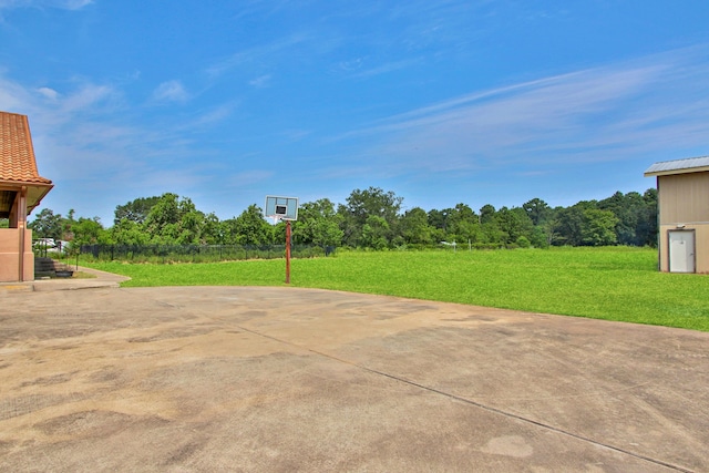 view of patio featuring basketball hoop