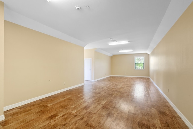 unfurnished room with wood-type flooring