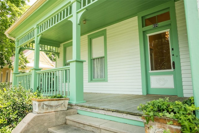 view of exterior entry with covered porch