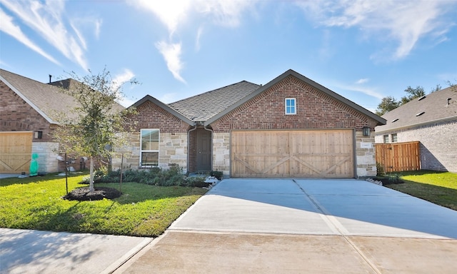 view of front of house featuring a front lawn and a garage