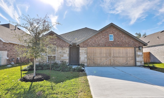 view of front of house featuring a garage and a front lawn