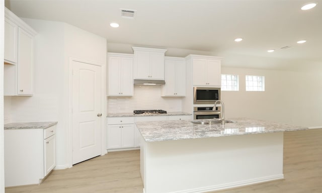 kitchen with white cabinetry and stainless steel appliances