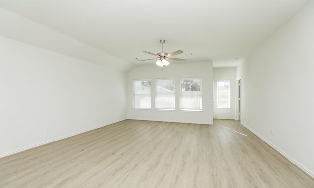 unfurnished living room with ceiling fan, light hardwood / wood-style floors, and vaulted ceiling