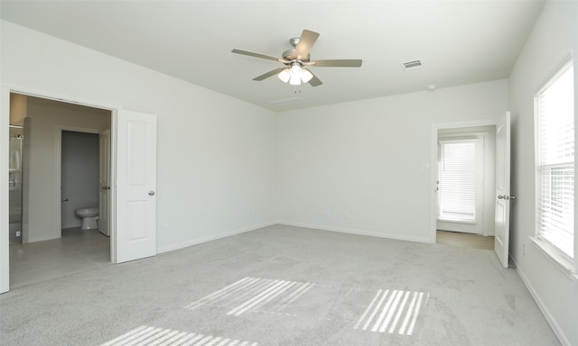 interior space with ceiling fan