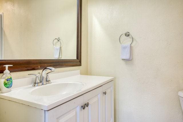 half bath with toilet and vanity