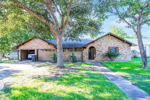 ranch-style house with a garage and a front lawn