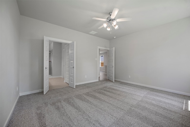 unfurnished bedroom with carpet flooring and ceiling fan